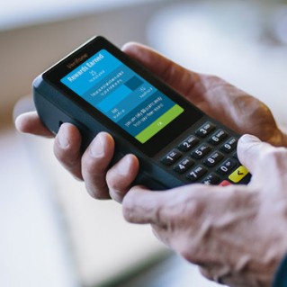 Verifone Commerce-Enabled Device in hand