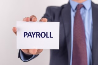 When Getting Paid Costs Money, Payroll Cards Draw Ire And Plaudits