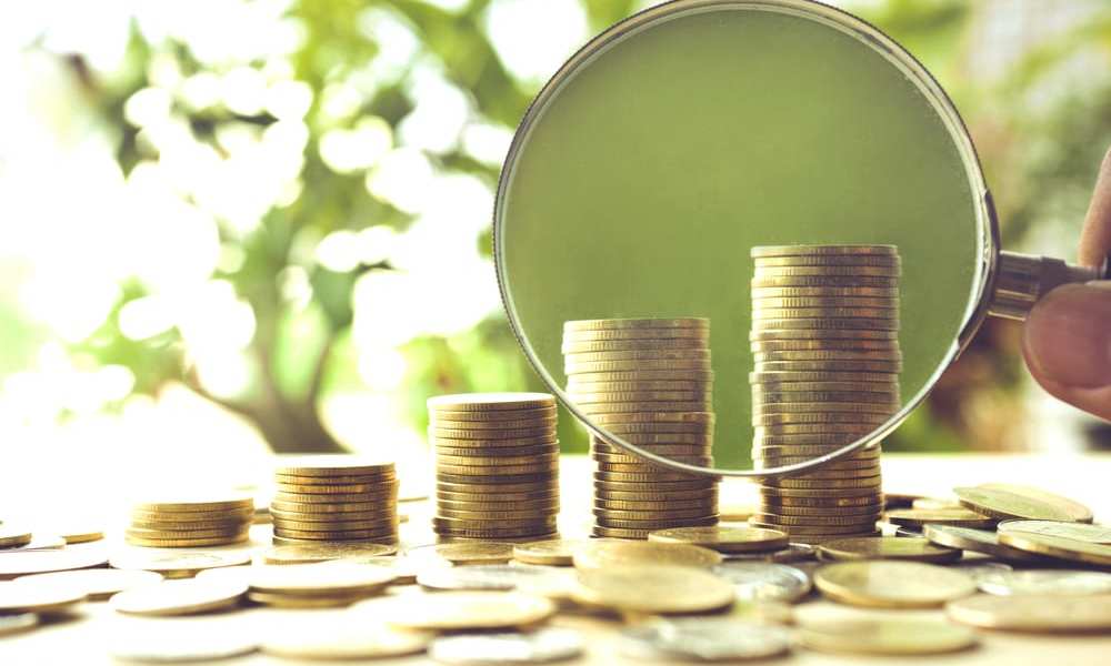 money in magnifying glass