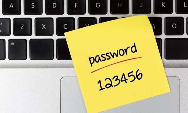 password sticky note on keyboard
