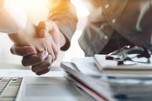 merger shaking hands