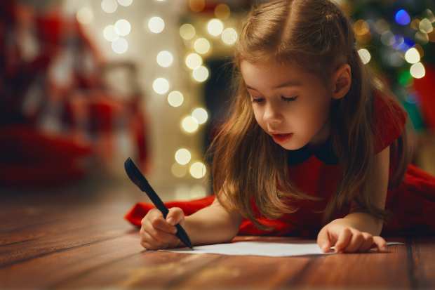 child writing letter to Santa