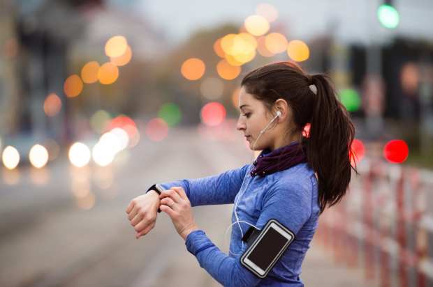runner with watch and smartphone