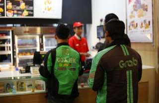 SoftBank Shareholders Push For Grab, Gojek Deal In Indonesia