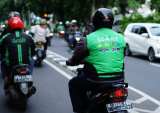 SoftBank Steps Up Pressure For Grab, Gojek Deal
