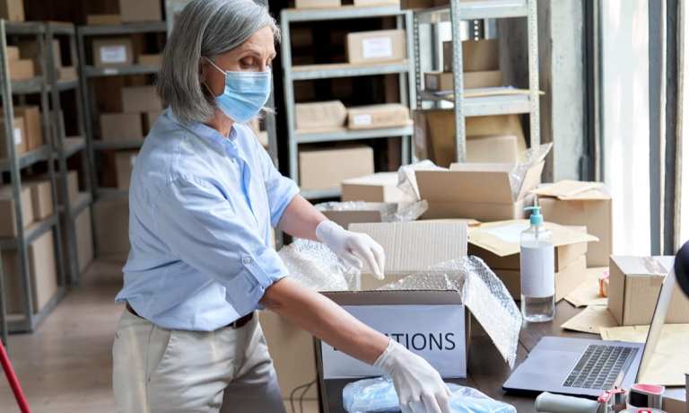 nonprofit worker loading boxes