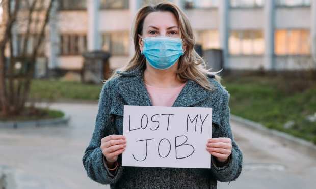 woman with lost my job sign
