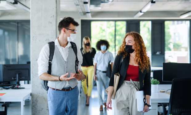 Employees Begin Slow Return To A Changed Workplace