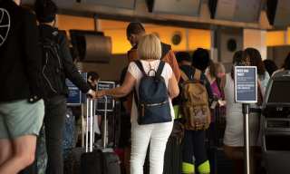 Travel Numbers Surge, Leading To Long Airport Wait Times