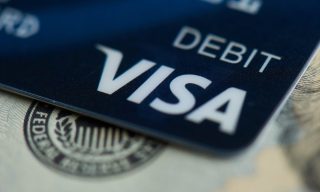 Bob Dole’s Passing Spurs Thoughts on Debit’s Heady Rise Since 1996