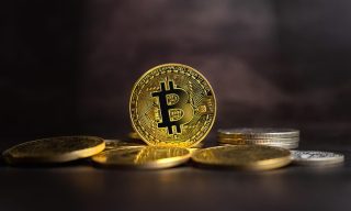 As Crypto Contagion Spurs Coinbase Layoffs, Bitcoin is Remarkably Steady