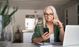 woman with smartphone and laptop
