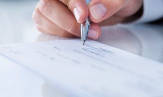 Real Estate Slow to Transition Away From Checks