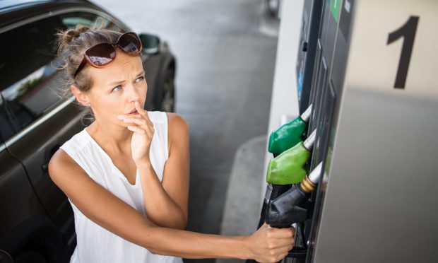 woman at gas pump