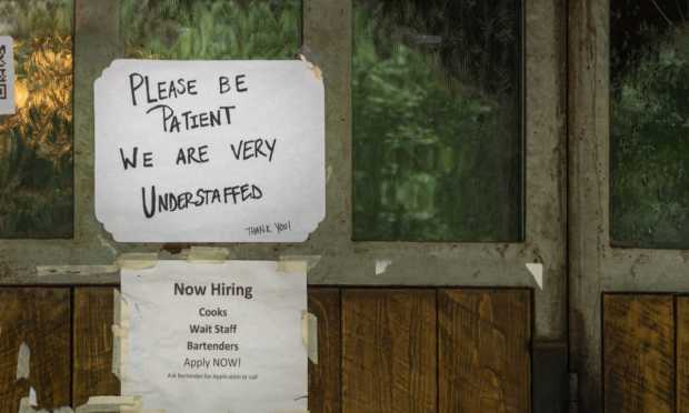 restaurant sign about staffing shortage
