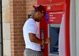 ATMs Take on New Tasks Even as Their Numbers Decline