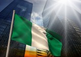 Nigeriam flag in front of buildings