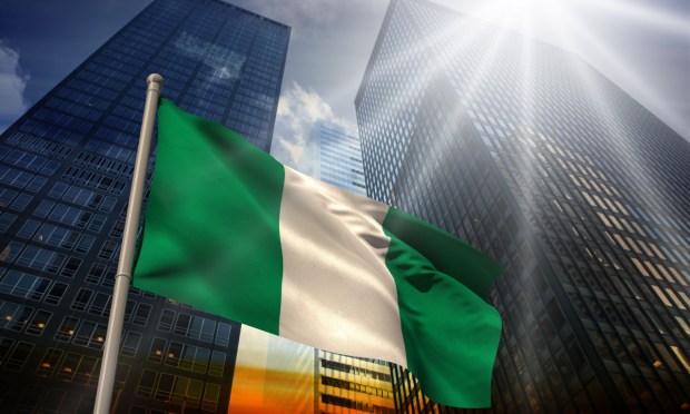 Nigeriam flag in front of buildings