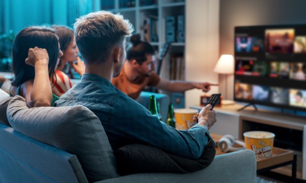 group of people watching streaming TV