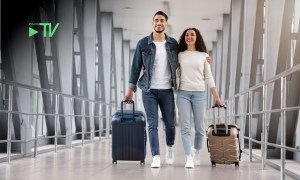 couple with suitcases at airport