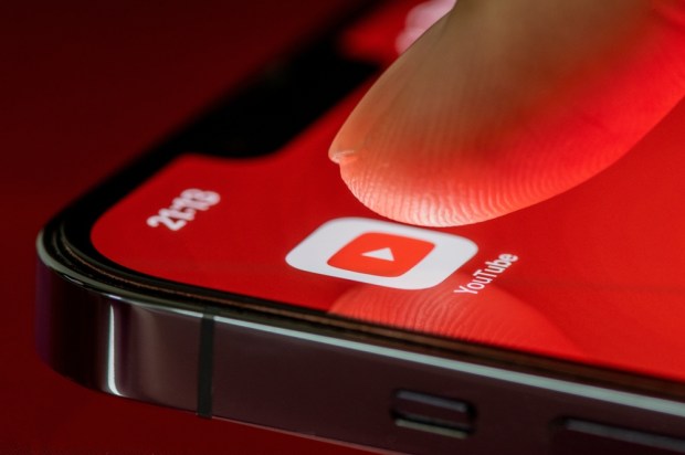 Finger,Touches,The,Youtube,Application,On,Smartphone,Screen,On,Red