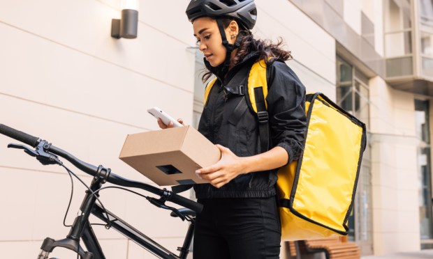 woman making delivery on bike