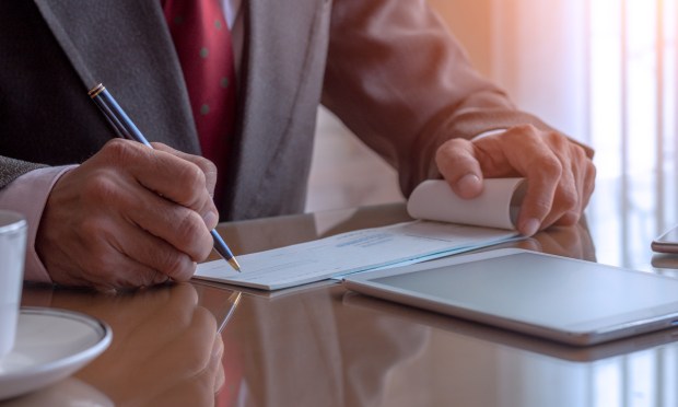 Making Sense of Why Some Firms Stay Stapled to Paper Processes