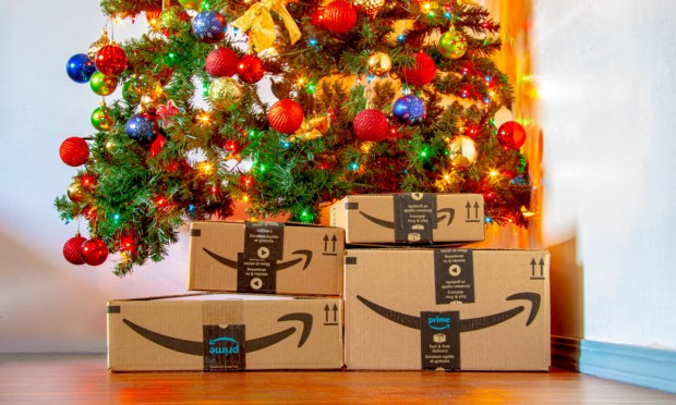Amazon boxes beneath Christmas tree