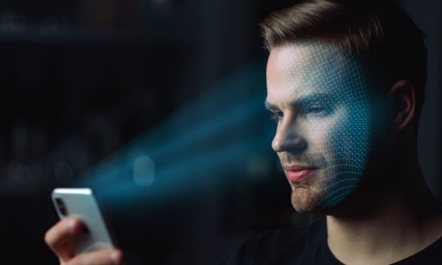 man using biometric facial recognition