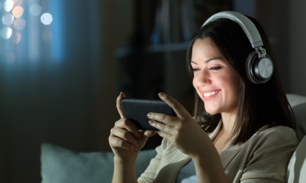 woman streaming movie on smartphone