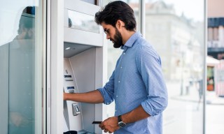 American Express Taps NCR Atleos for Surcharge-Free ATM Access