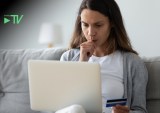 woman paying online, worried