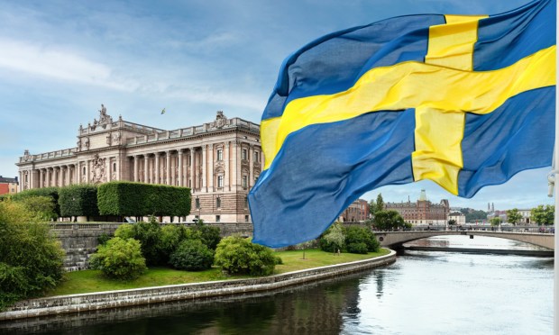 Swedish Parliament building and flag