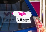 Uber and Lyft stickers on car