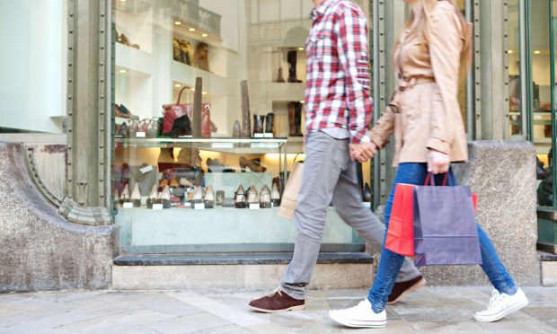 couple walking with shopping bag