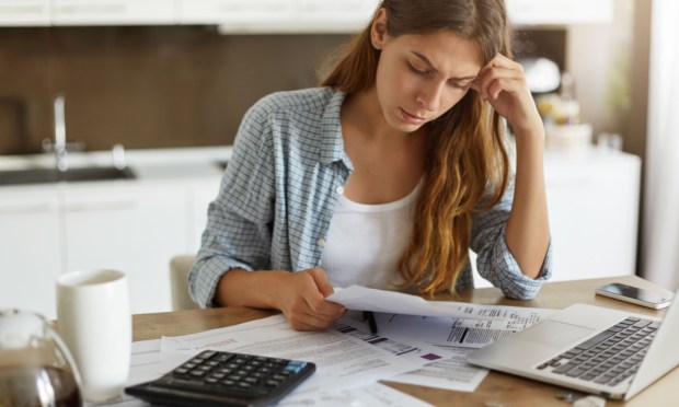 young woman doing household finances