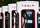 Tesla Calls Itself an AI, Robotics Company as Profits Plunge 55% 