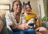 two young people playing video game