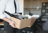 laid off employee with box
