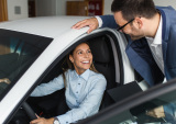 young woman buying new car