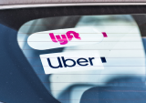 Lyft and Uber stickers on car