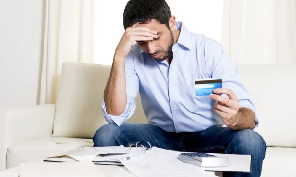 man with credit card bills