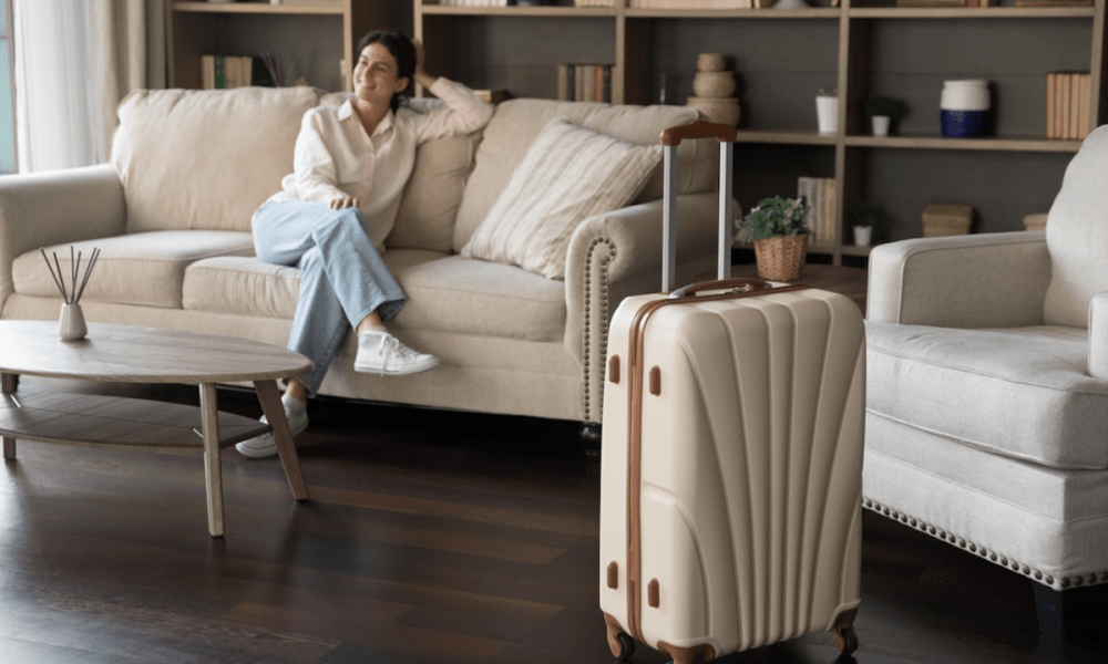 woman with suitcase at short-term rental