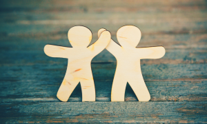 2 wooden cutout figures