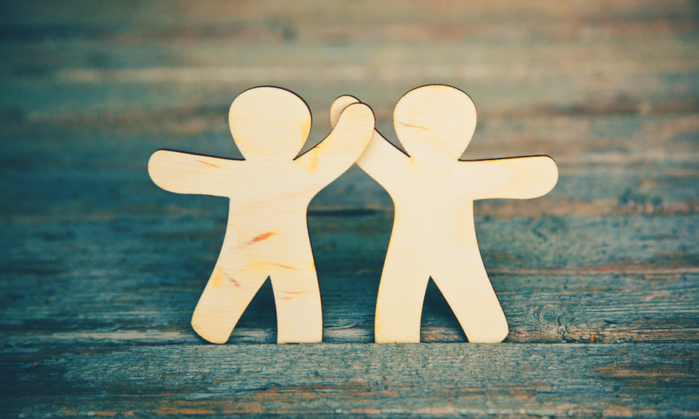 2 wooden cutout figures