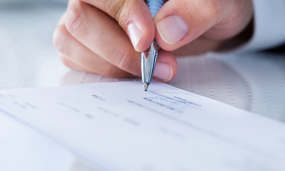 person writing check