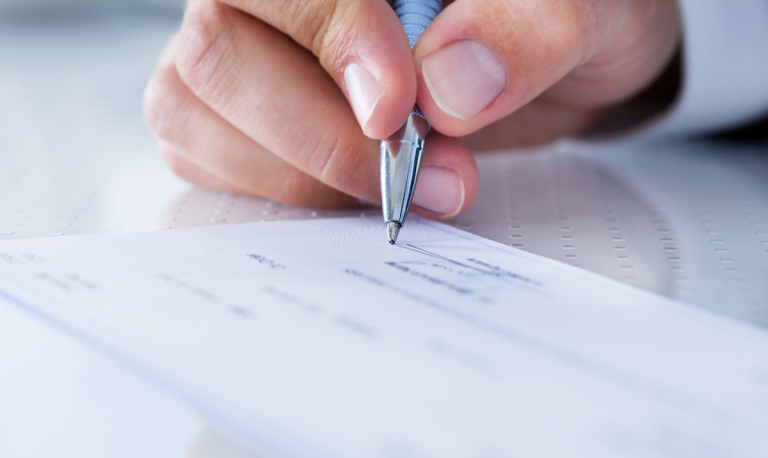 person writing check