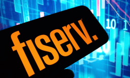Fiserv on phone with stock charts behind
