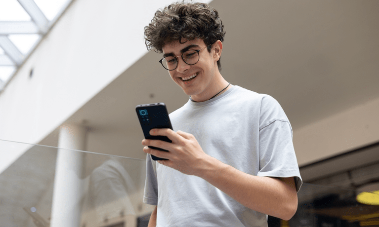 teenaged boy with smartphone