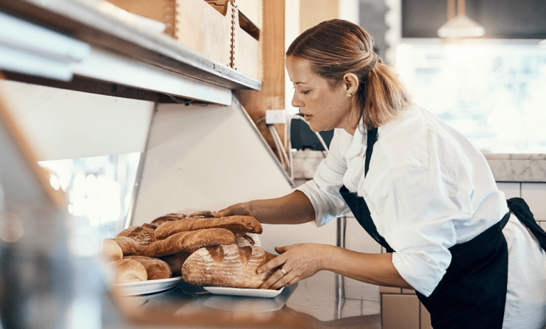 bakery owner with breads